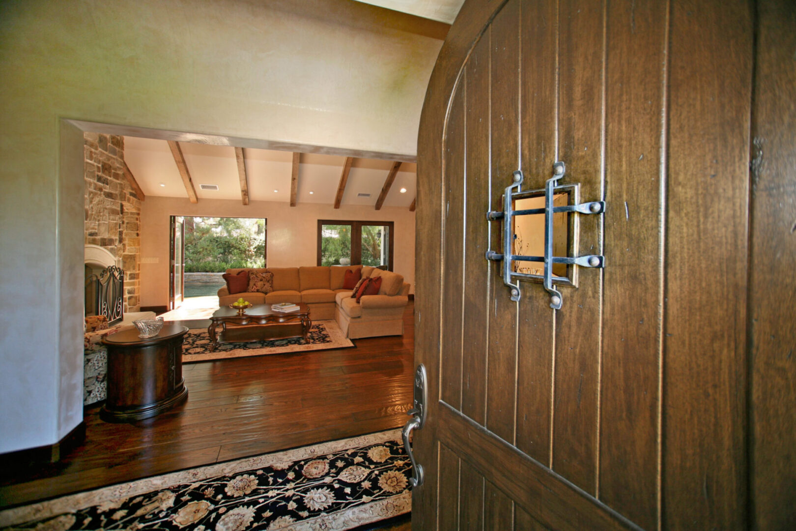 A door open to the living room with wood paneling.