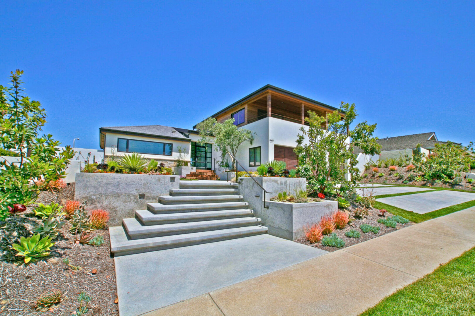 A house with steps leading to the front of it.